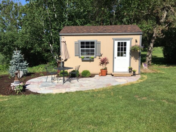 10x16 U Tan with Charcoal trim Brownwood Shingles tall sidewalls 3x3 window Charcoal shutters Gray flowerboxes Mike Schultz2