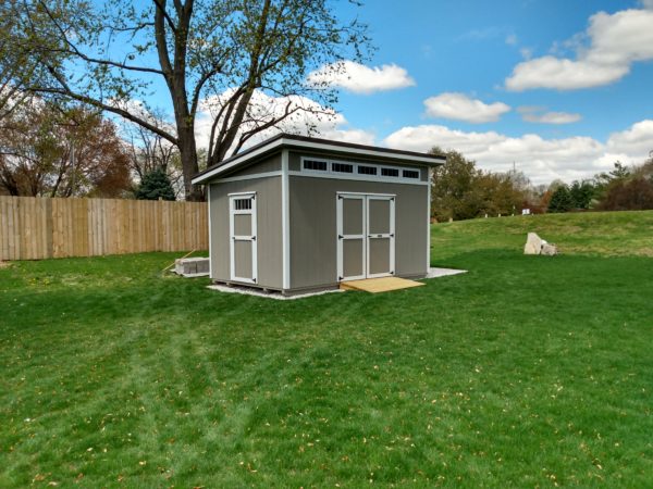 10x16 LT Painted Taupe with White trim Burnished Slate Metal 12inch overhangs transom windows above double doors Richard White Jr.